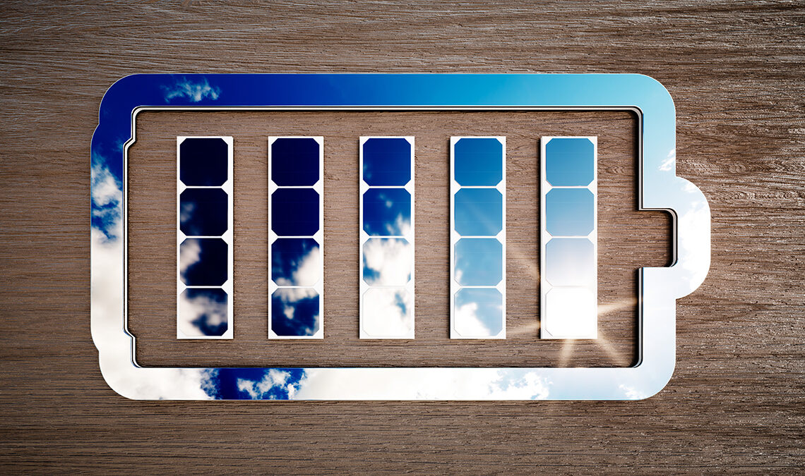 Renewable energy storage sign on dark wooden desk.